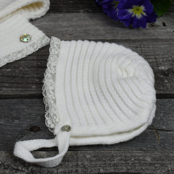 Newborn knitted cardigan and bonnet set