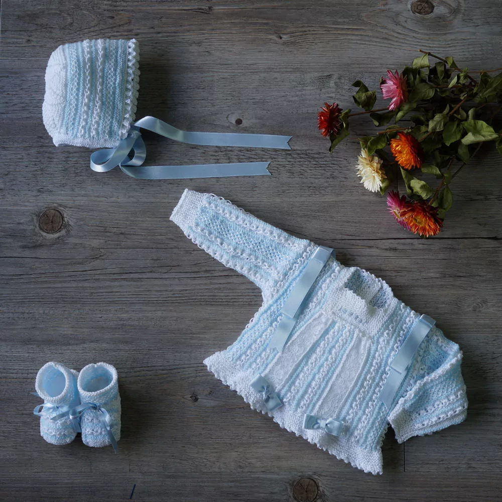 Heirloom hand knitted baby sweater set